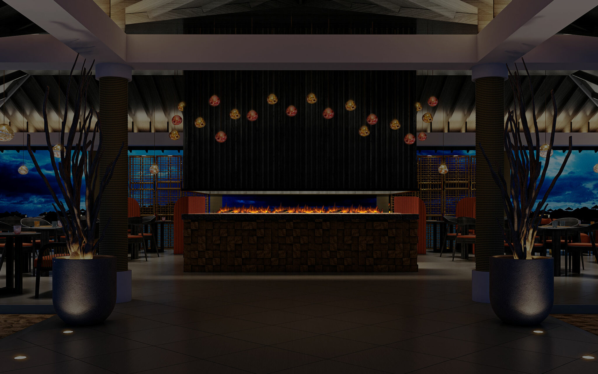 A modern restaurant interior with a central stone fireplace, glowing warmly. Hanging lights create a cozy ambiance. Potted plants and dining tables flank the space.
